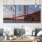 Three-panel canvas wall art featuring golden gate bridge spanning bay, displayed in a modern living room above seating.