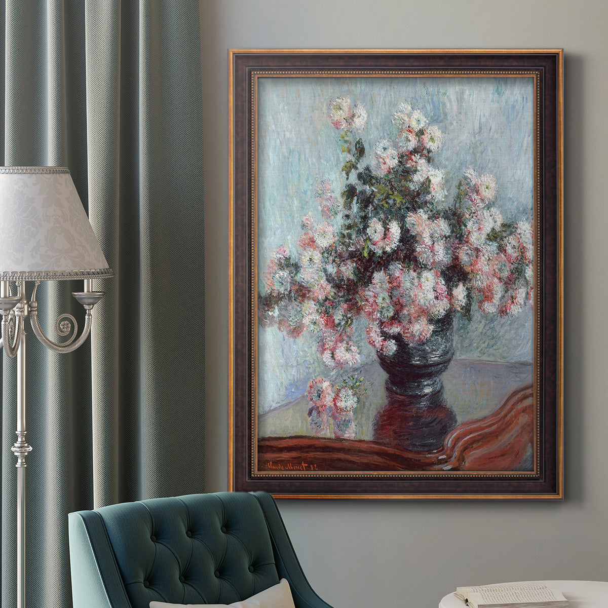 Impressionist chrysanthemum floral painting by Claude Monet in an ornate bronzed mahogany wood frame displayed in a dark-toned interior setting.