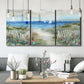 Three-panel canvas wall art featuring lush coastal garden landscape, displayed in a modern living room above seating.