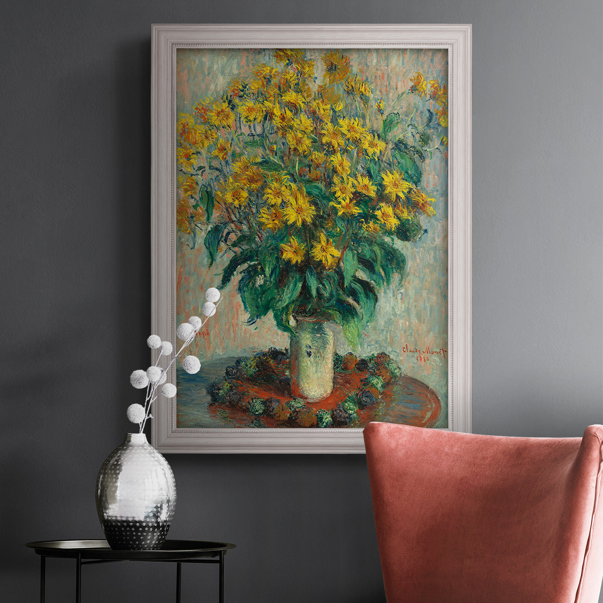 Impressionist floral painting of artichoke flowers by Claude Monet in an ornate weathered white frame displayed in a dark-toned interior setting.