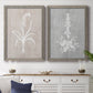 Set of two gray barnwood framed canvas prints depicting a coordinated art pair of white botanical silhouettes on softly weathered neutral backgrounds rendered as rustic minimalist botanical prints above a dining room sideboard.