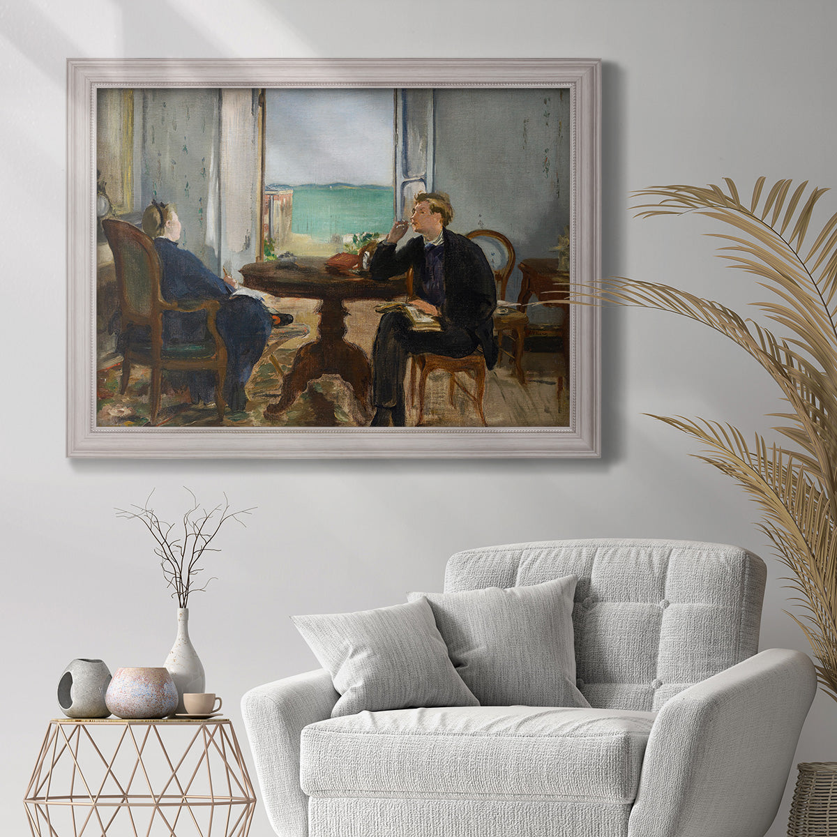Impressionist interior scene by Édouard Manet in an ornate weathered white frame displayed in a bright interior setting.