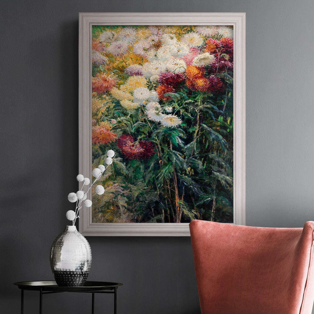 Impressionist garden floral painting by Gustave Caillebotte in an ornate weathered white frame displayed in a dark-toned interior setting.