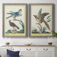 Set of two gray barnwood framed canvas prints depicting a coordinated art pair of misty blue gray and violet marks hovering across pale grounds rendered as atmospheric abstract paintings above a dining room sideboard.