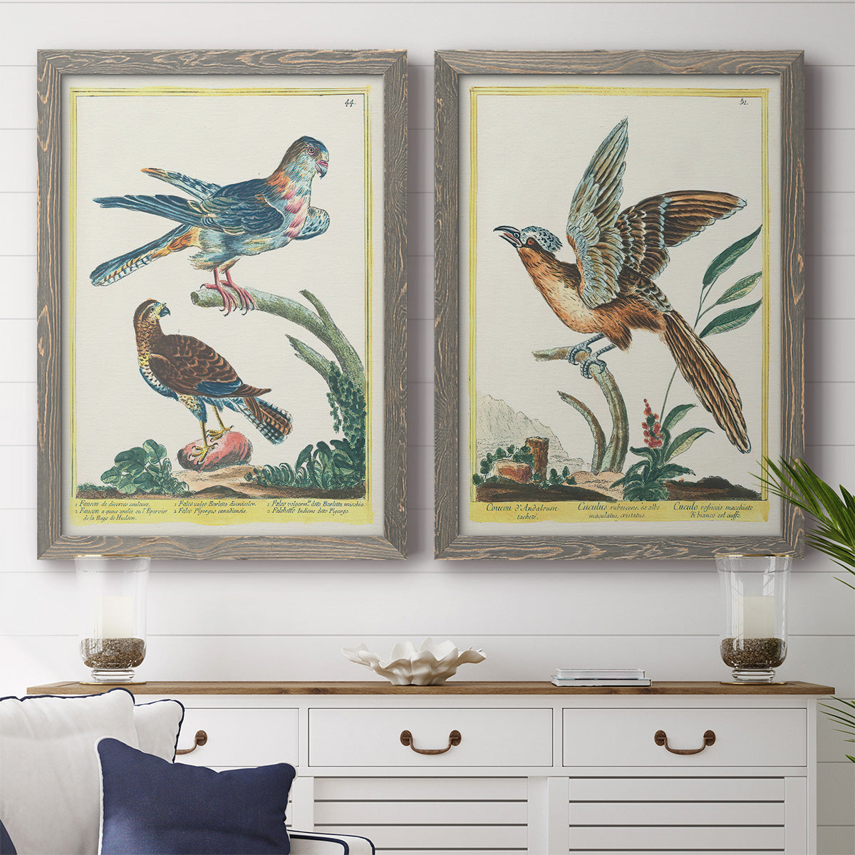 Set of two gray barnwood framed canvas prints depicting a coordinated art pair of misty blue gray and violet marks hovering across pale grounds rendered as atmospheric abstract paintings above a dining room sideboard.