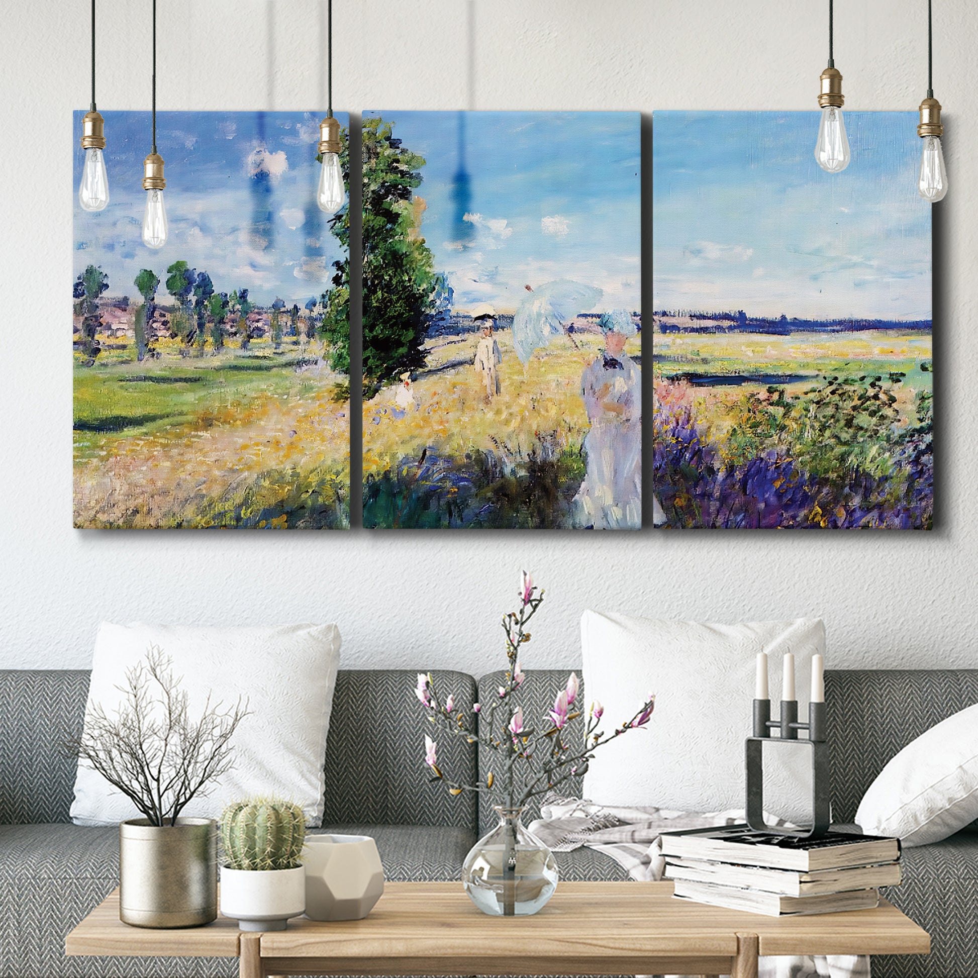 Three-panel canvas wall art featuring riverside path with figures, displayed in a modern living room above seating.