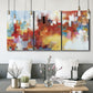 Three-panel canvas wall art featuring abstract city lights composition, displayed in a modern living room above seating.