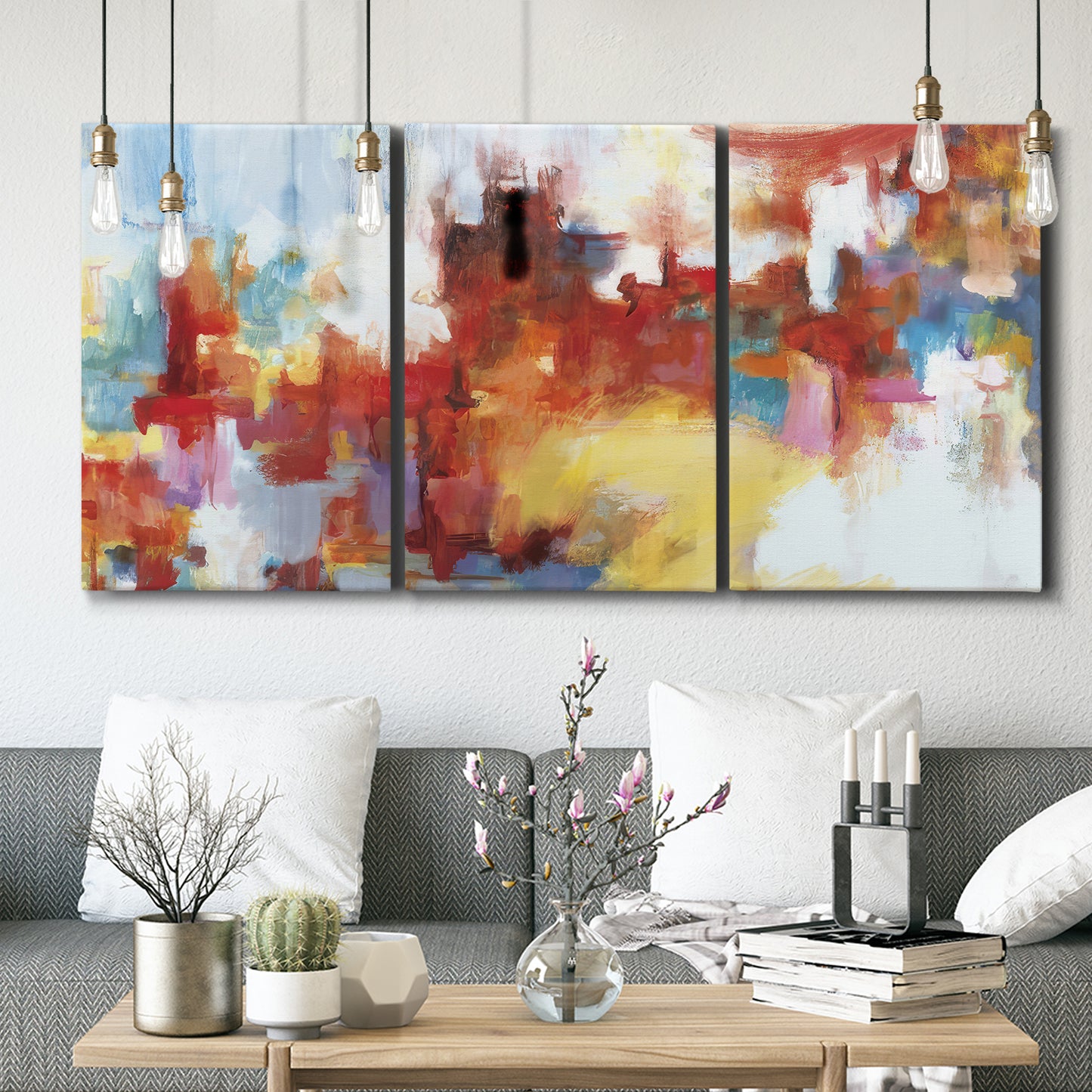 Three-panel canvas wall art featuring abstract city lights composition, displayed in a modern living room above seating.