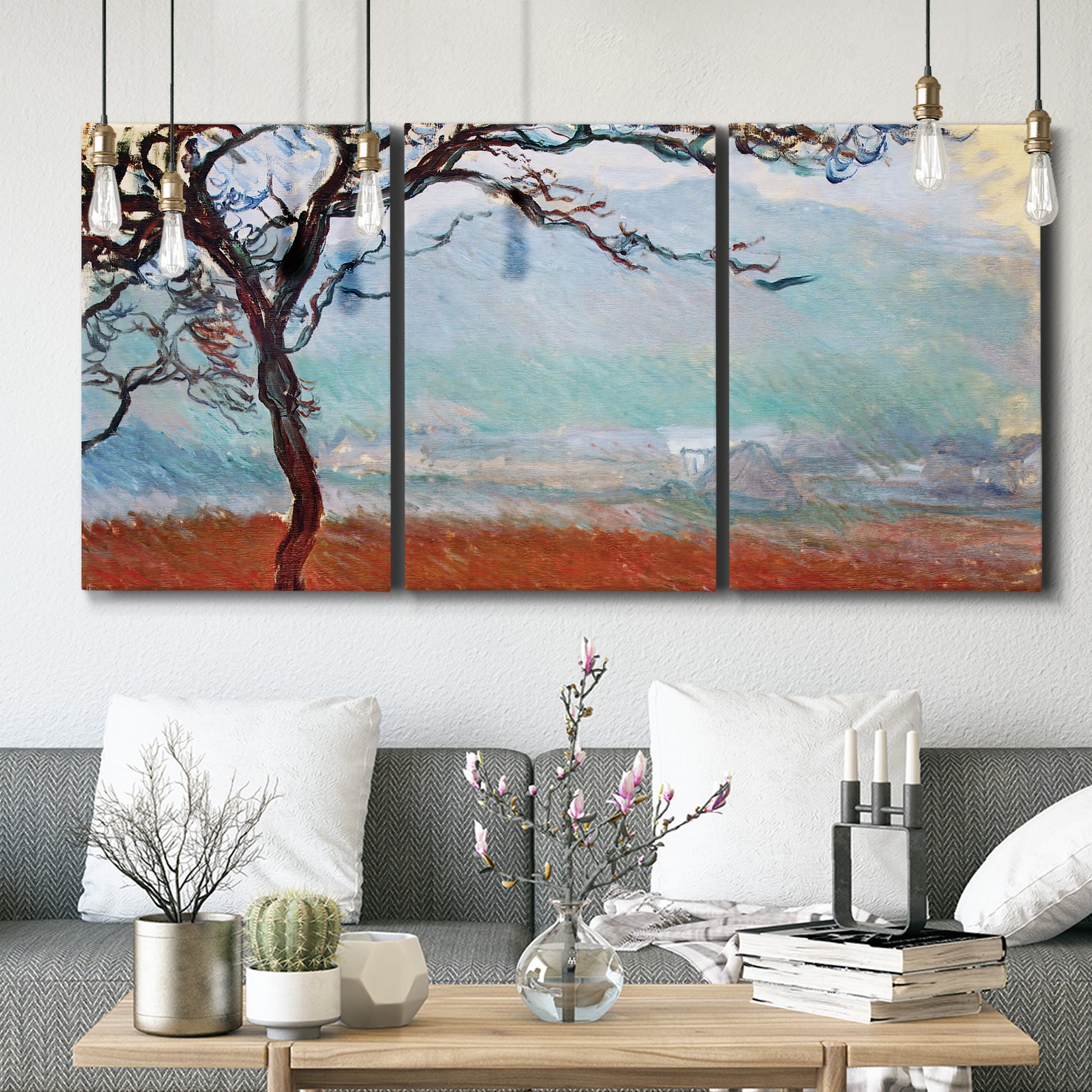 Three-panel canvas wall art featuring coastal trees at evening light, displayed in a modern living room above seating.