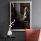 Quiet interior genre scene of a woman with scales by Johannes Vermeer in an ornate champagne frame displayed in a dark-toned interior setting.