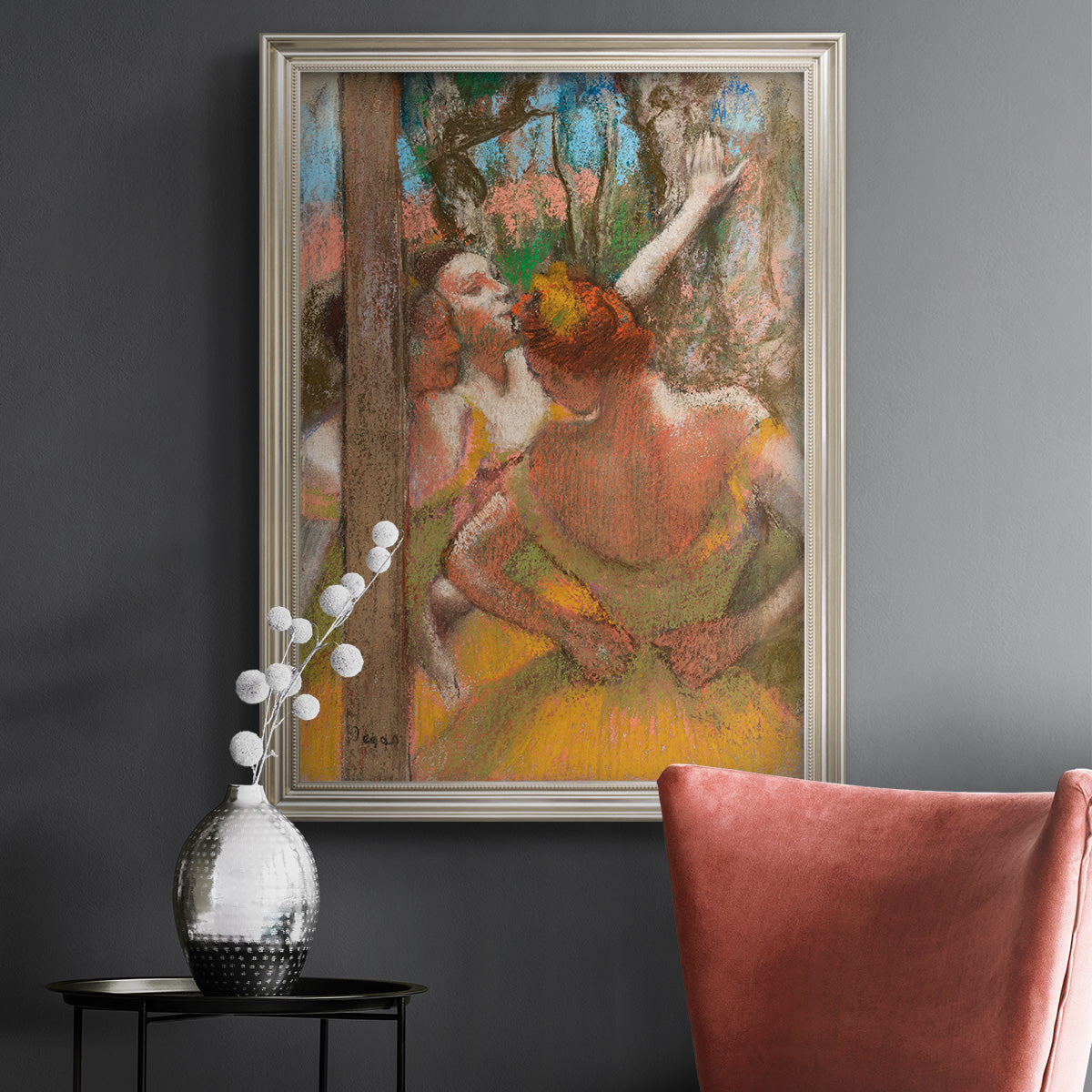 Impressionist ballet dancer composition by Edgar Degas in an ornate champagne frame displayed in a dark-toned interior setting.