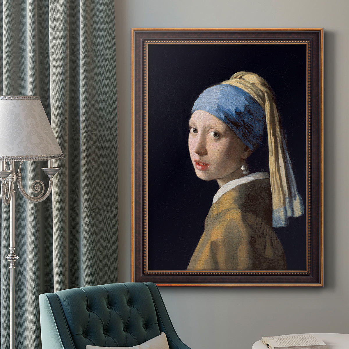 Iconic portrait of a girl wearing a pearl earring by Johannes Vermeer in an ornate bronzed mahogany wood frame displayed in a dark-toned interior setting.