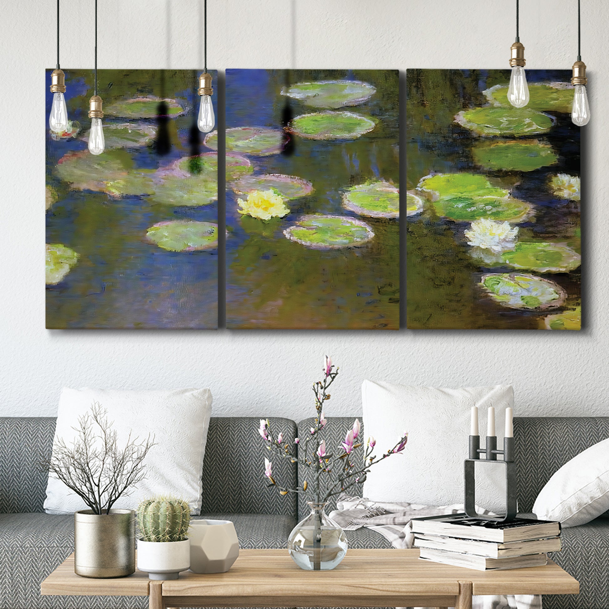 Three-panel canvas wall art featuring yellow and white water lilies, displayed in a modern living room above seating.