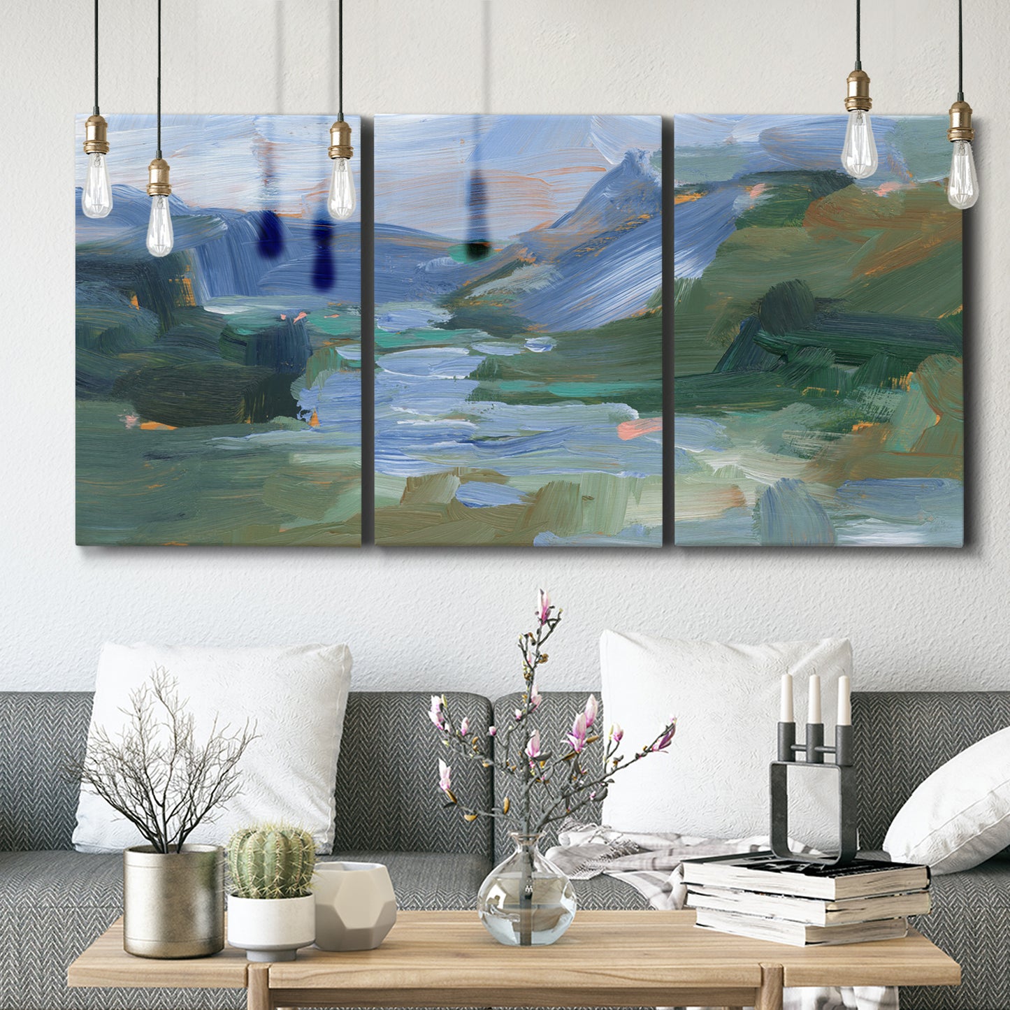Three-panel canvas wall art featuring abstract landscape composition study, displayed in a modern living room above seating.