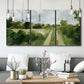 Three-panel canvas wall art featuring meadow trail through open grassland, displayed in a modern living room above seating.