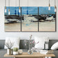 Three-panel canvas wall art featuring abstract bridge landscape in cyan, displayed in a modern living room above seating.
