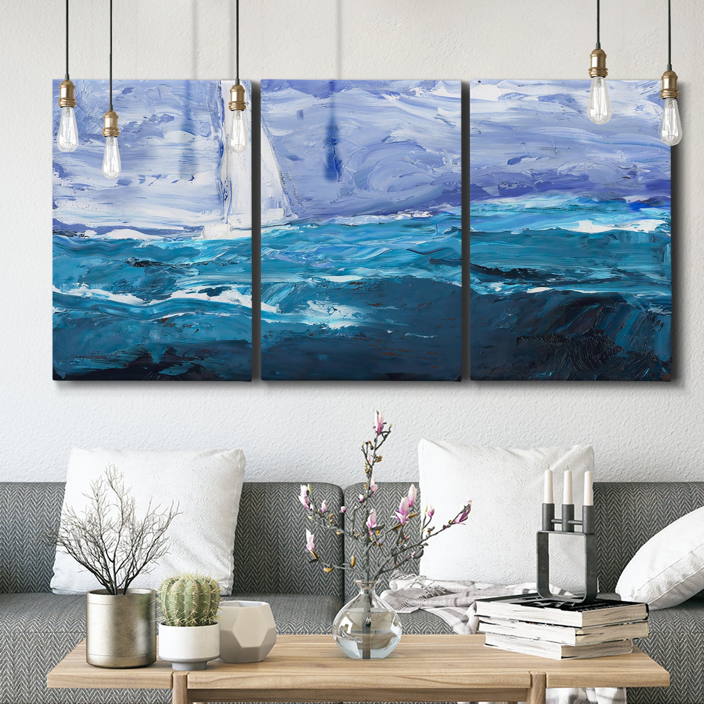 Three-panel canvas wall art featuring impressionist nautical harbor scene, displayed in a modern living room above seating.