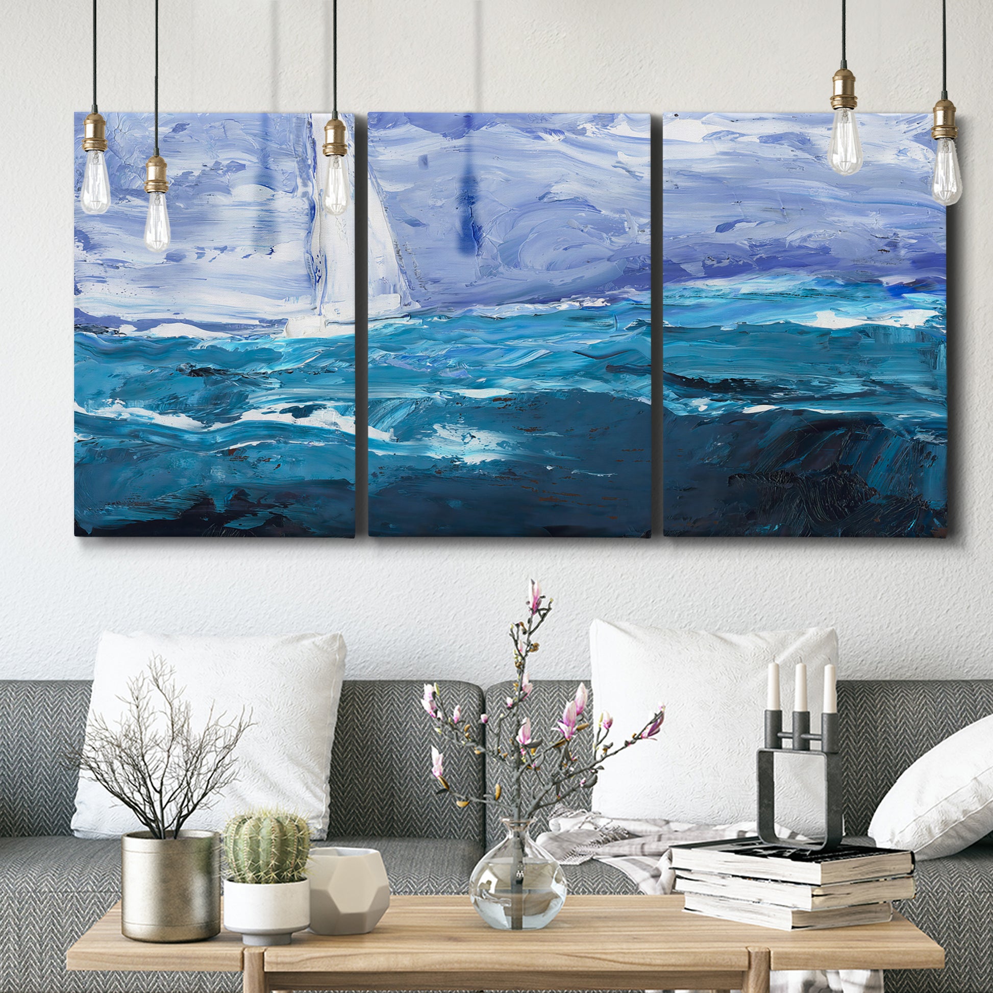 Three-panel canvas wall art featuring impressionist nautical harbor scene, displayed in a modern living room above seating.