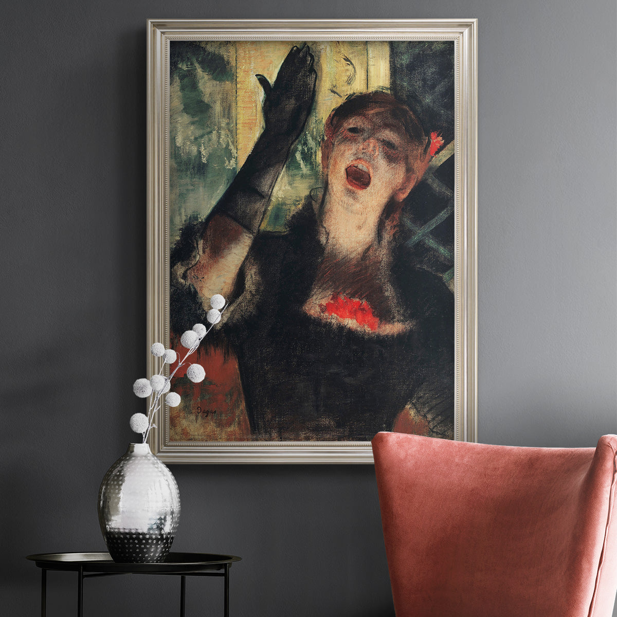 Impressionist portrait of a café singer by Edgar Degas in an ornate champagne frame displayed in a dark-toned interior setting.