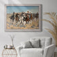 Impressionist western action scene by Frederic Remington in an ornate weathered white frame displayed in a bright interior setting.