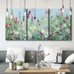 Three-panel canvas wall art featuring night landscape silhouette photography, displayed in a modern living room above seating.