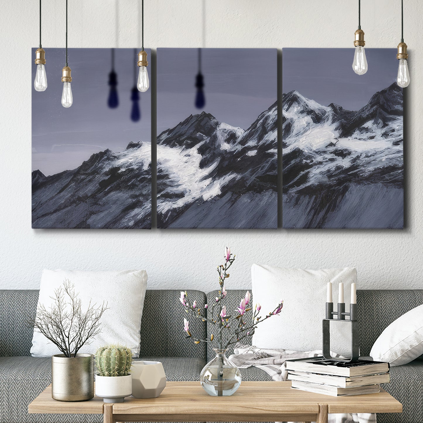 Three-panel canvas wall art featuring moonlit mountain peaks under night sky, displayed in a modern living room above seating.