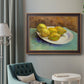 Impressionist still life with lemons by Vincent van Gogh in an ornate bronzed mahogany wood frame displayed in a bright interior setting.