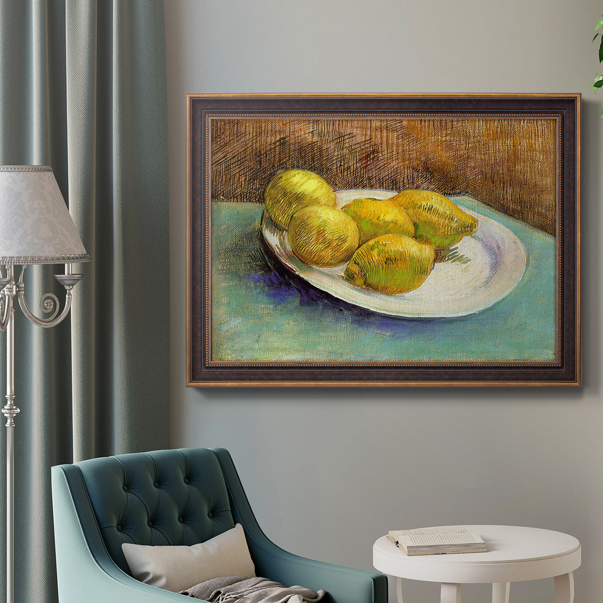 Impressionist still life with lemons by Vincent van Gogh in an ornate bronzed mahogany wood frame displayed in a bright interior setting.