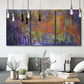 Three-panel canvas wall art featuring abstract rainfall with butterfly forms, displayed in a modern living room above seating.