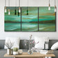 Three-panel canvas wall art featuring hidden coastal cove landscape, displayed in a modern living room above seating.