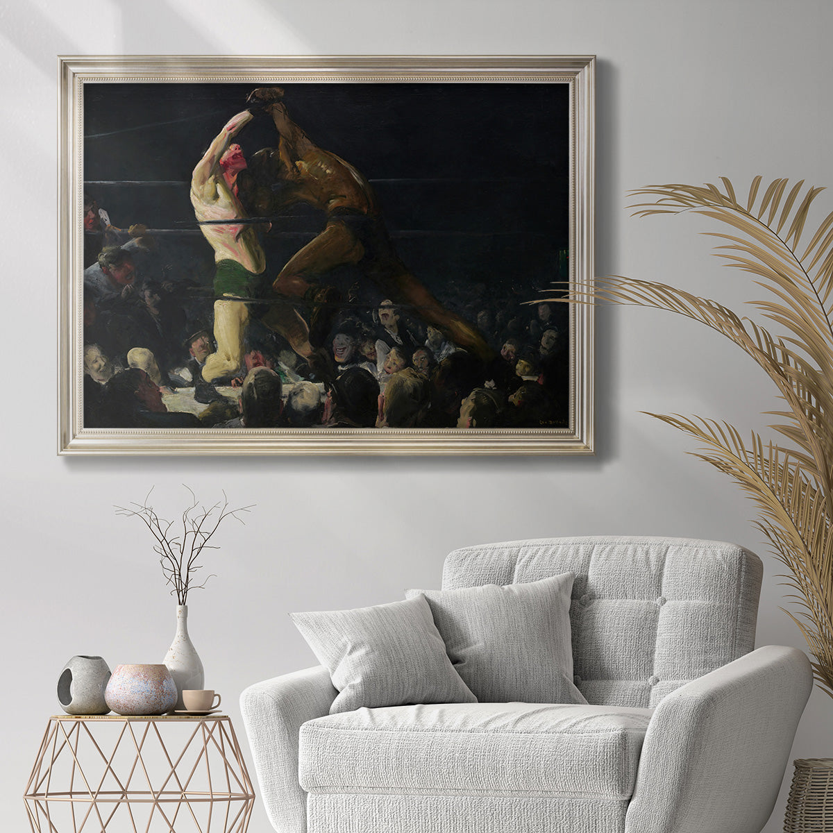 American genre painting of men in a social club by George Bellows in an ornate champagne frame displayed in a bright interior setting.