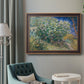 Impressionist lilac flower painting by Vincent van Gogh in an ornate bronzed mahogany wood frame displayed in a bright interior setting.