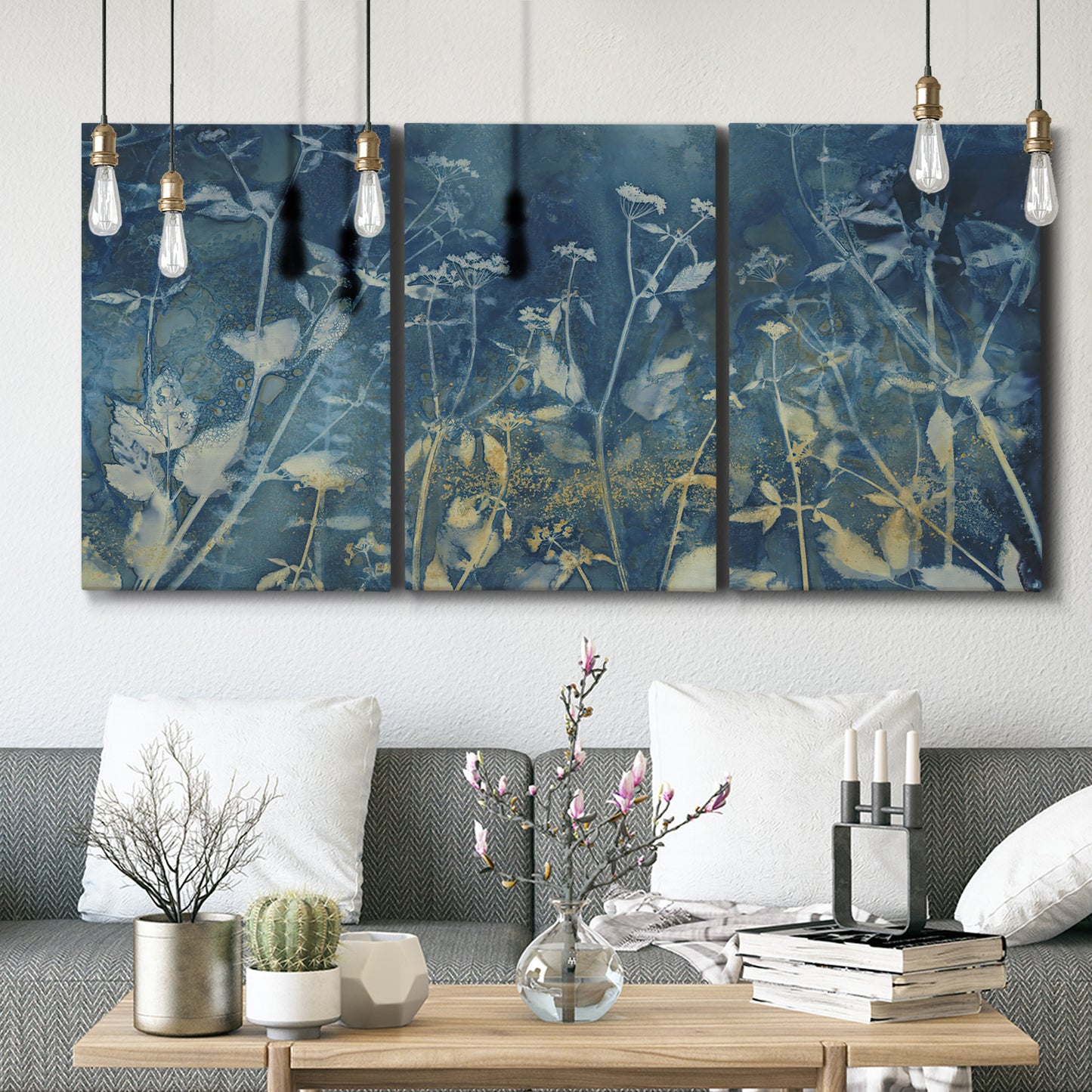 Three-panel canvas wall art featuring dark abstract with rich tonal depth, displayed in a modern living room above seating.