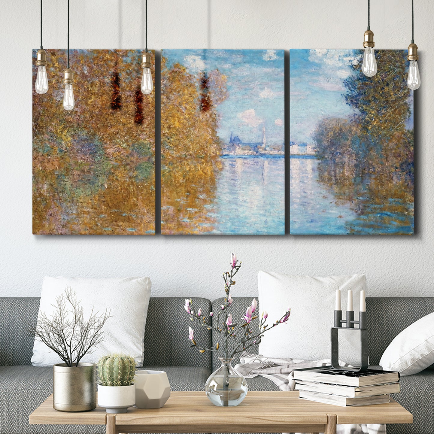 Three-panel canvas wall art featuring autumn landscape with glowing foliage, displayed in a modern living room above seating.
