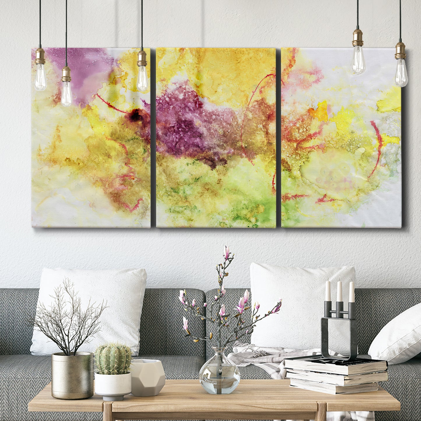Three-panel canvas wall art featuring abstract floral rhythm composition, displayed in a modern living room above seating.