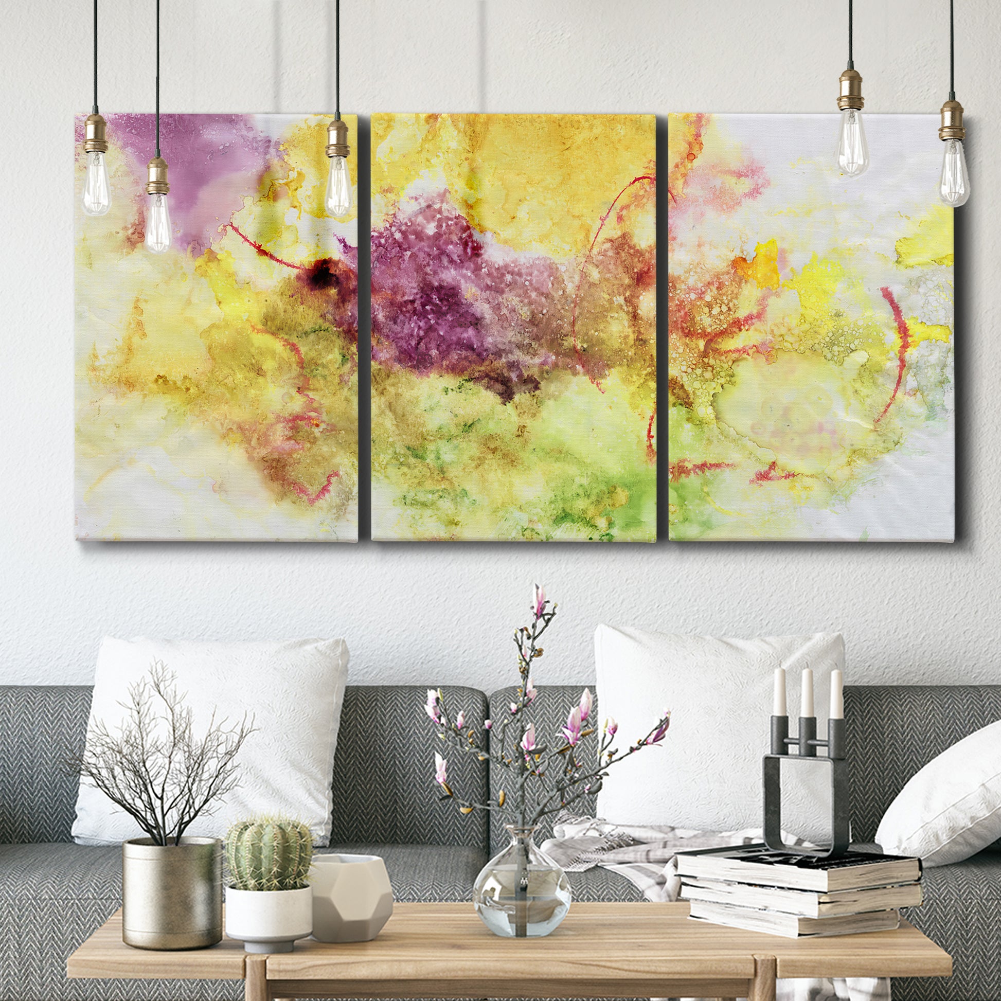 Three-panel canvas wall art featuring abstract floral rhythm composition, displayed in a modern living room above seating.