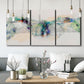 Three-panel canvas wall art featuring abstract mountain range watercolor, displayed in a modern living room above seating.