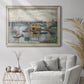 Impressionist river bridge scene on an overcast day by Claude Monet in an ornate champagne frame displayed in a bright interior setting.