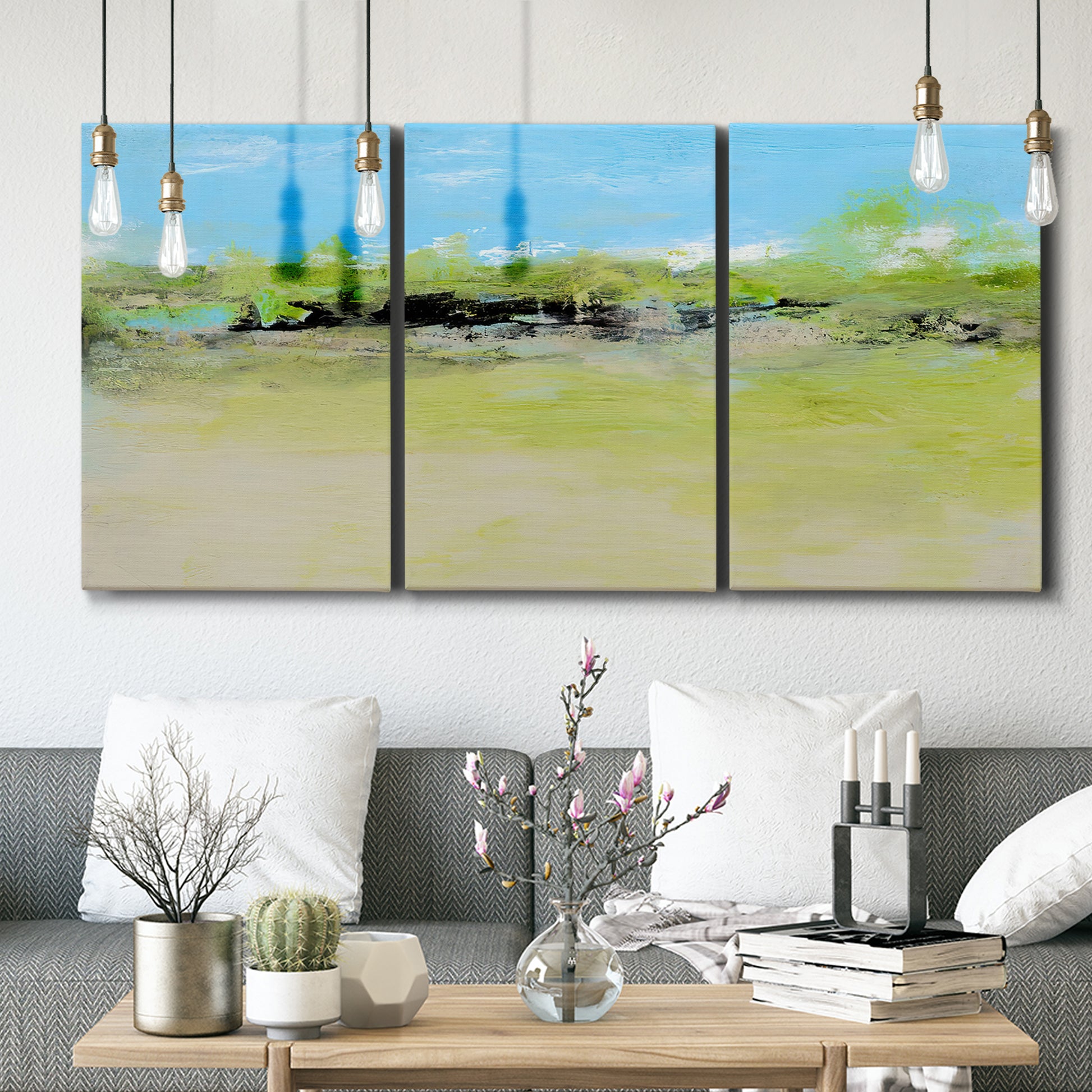 Three-panel canvas wall art featuring abstract terrace landscape view, displayed in a modern living room above seating.