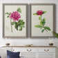 Set of two gray barnwood framed canvas prints depicting a coordinated art pair of pink flowering plant specimens rendered as vintage botanical plate illustrations above a dining room sideboard.