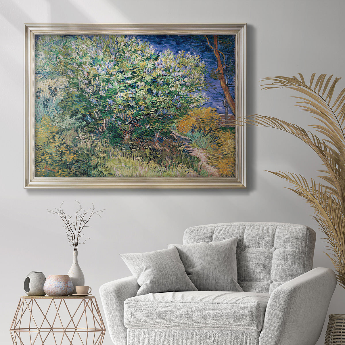 Impressionist lilac flower painting by Vincent van Gogh in an ornate champagne frame displayed in a bright interior setting.
