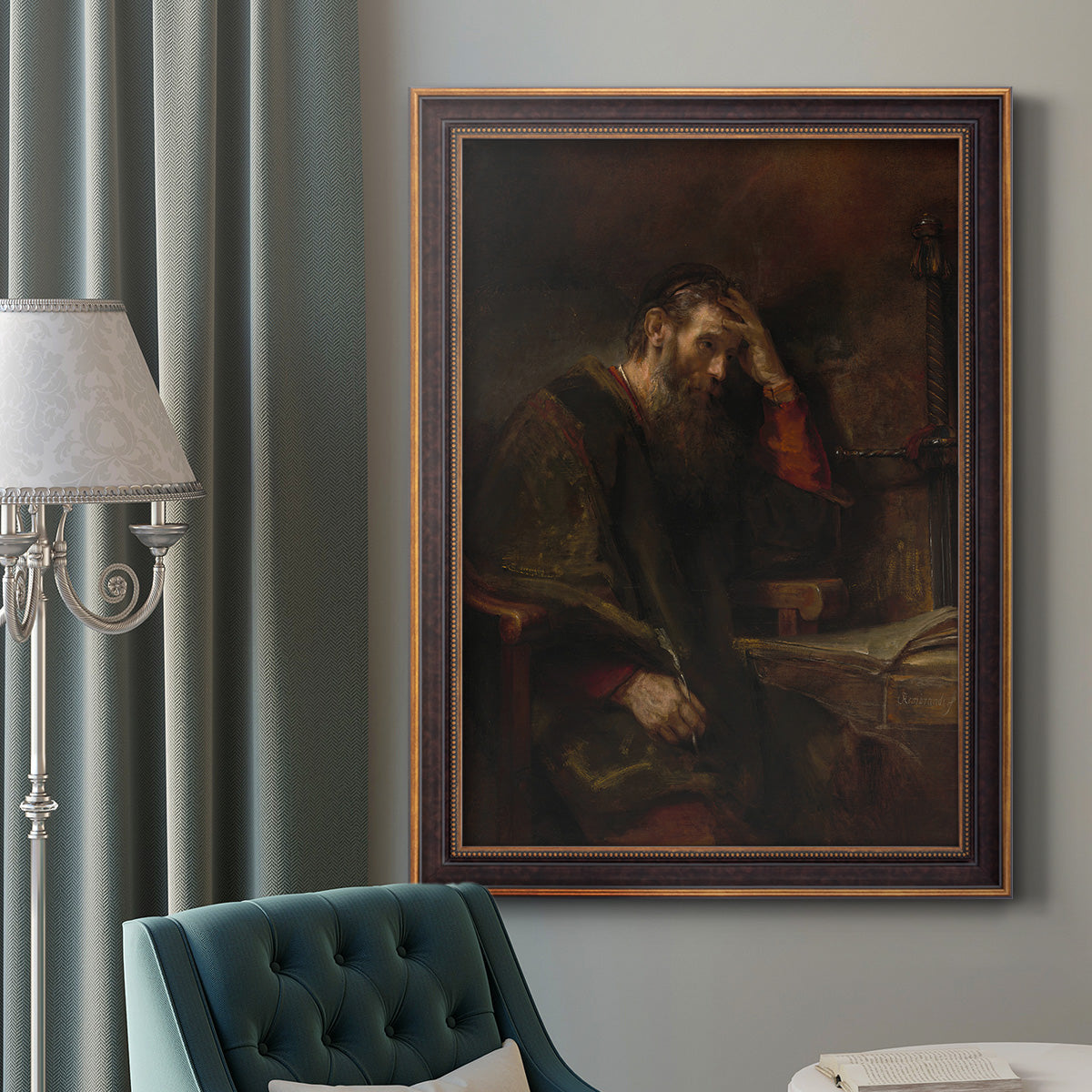 Classical religious portrait of Paul the Apostle by Rembrandt van Rijn in an ornate bronzed mahogany wood frame displayed in a dark-toned interior setting.