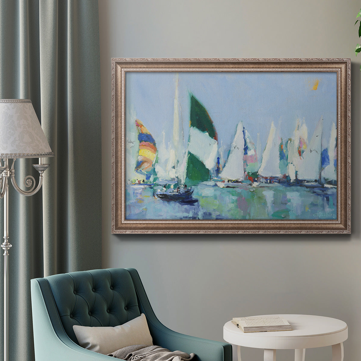 Coastal harbor watercolor painting in an ornate traditional silver frame displayed in a neutral interior setting.
