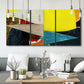 Three-panel canvas wall art featuring geometric mid century abstract blocks, displayed in a modern living room above seating.