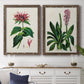 Set of two walnut barnwood framed canvas prints depicting a coordinated art pair of colorful flowering plant specimens rendered as antique botanical plate illustrations above a dining room sideboard.