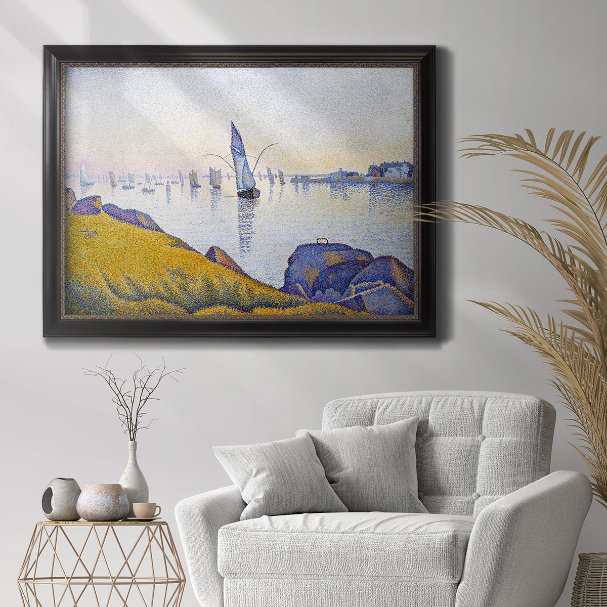 Impressionist coastal harbor at dusk by Paul Signac in an ornate black frame with gilded inner detail displayed in a bright interior setting.