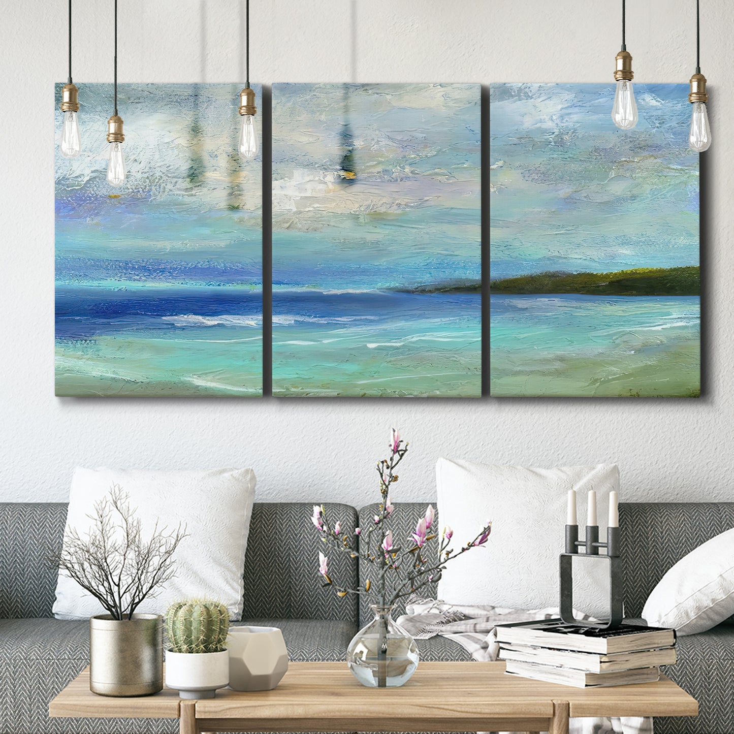 Three-panel canvas wall art featuring narrow island inlet waters, displayed in a modern living room above seating.