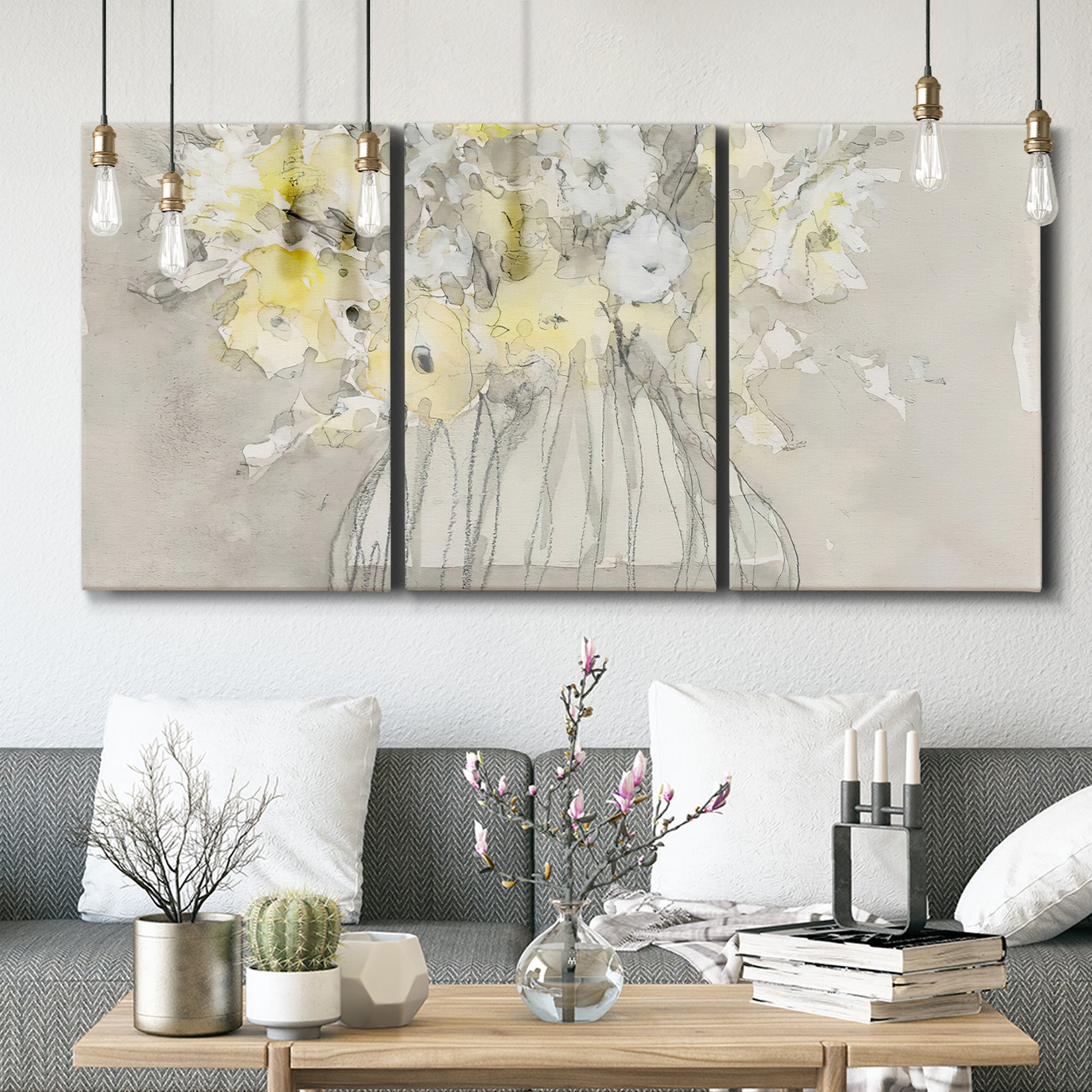 Three-panel canvas wall art featuring vintage floral abstract composition, displayed in a modern living room above seating.