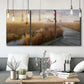 Three-panel canvas wall art featuring coastal path leading to shore, displayed in a modern living room above seating.