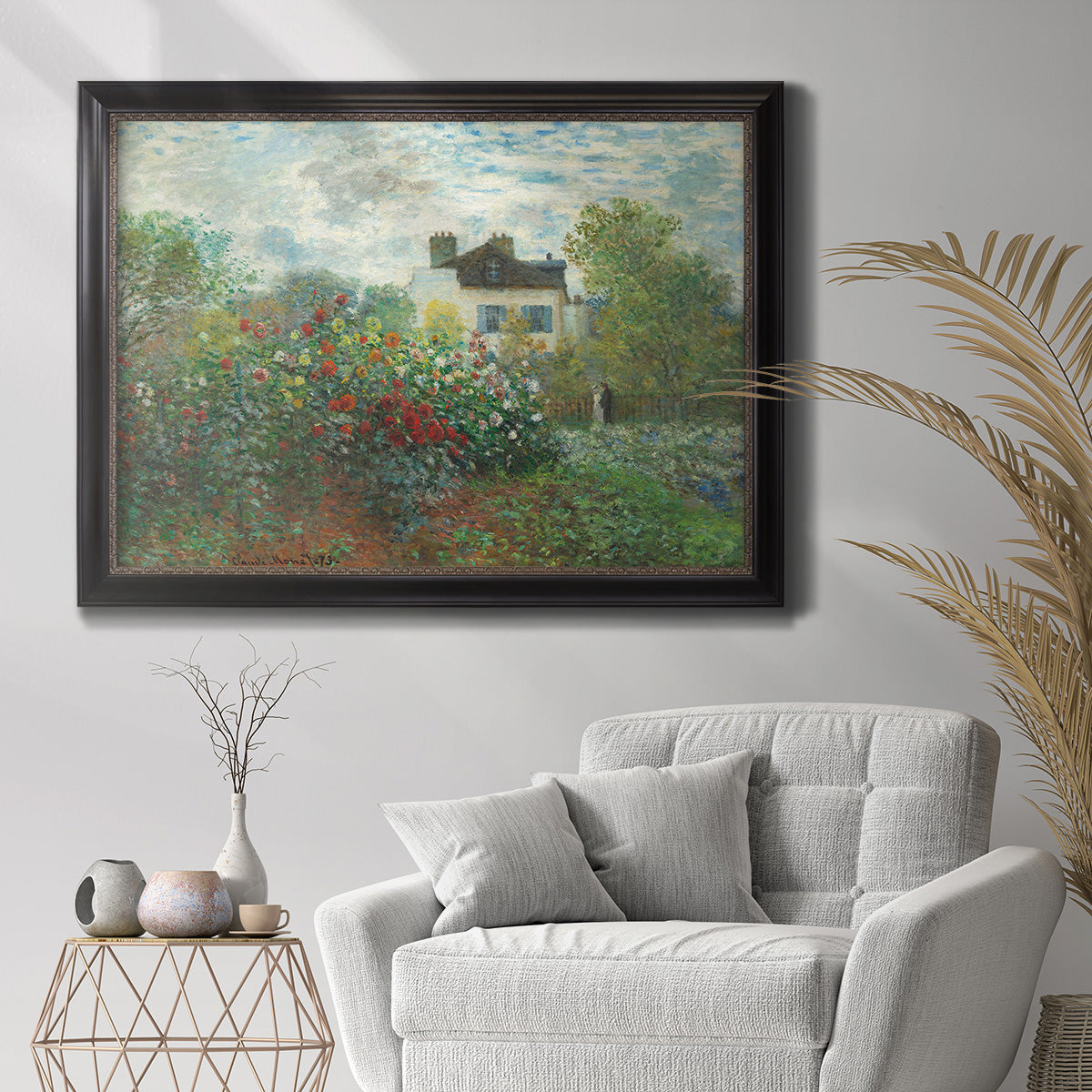 Impressionist garden landscape at Argenteuil by Claude Monet in an ornate black frame with gilded inner detail displayed in a bright interior setting.
